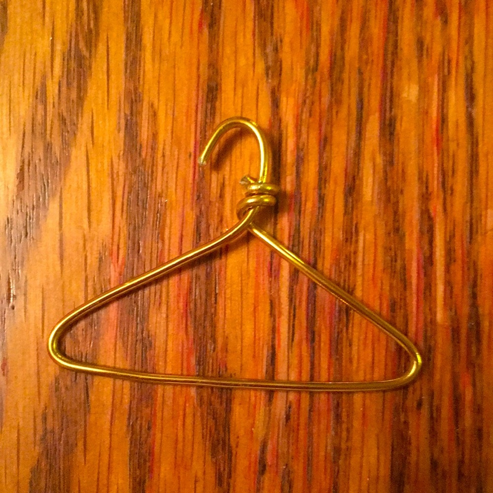 Pro-choice gold coat hanger necklace